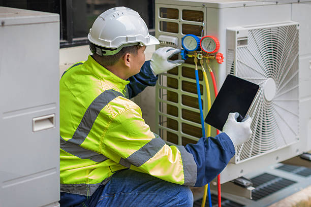 Professional Air Conditioning Repair technician working in DeFuniak Springs, FL